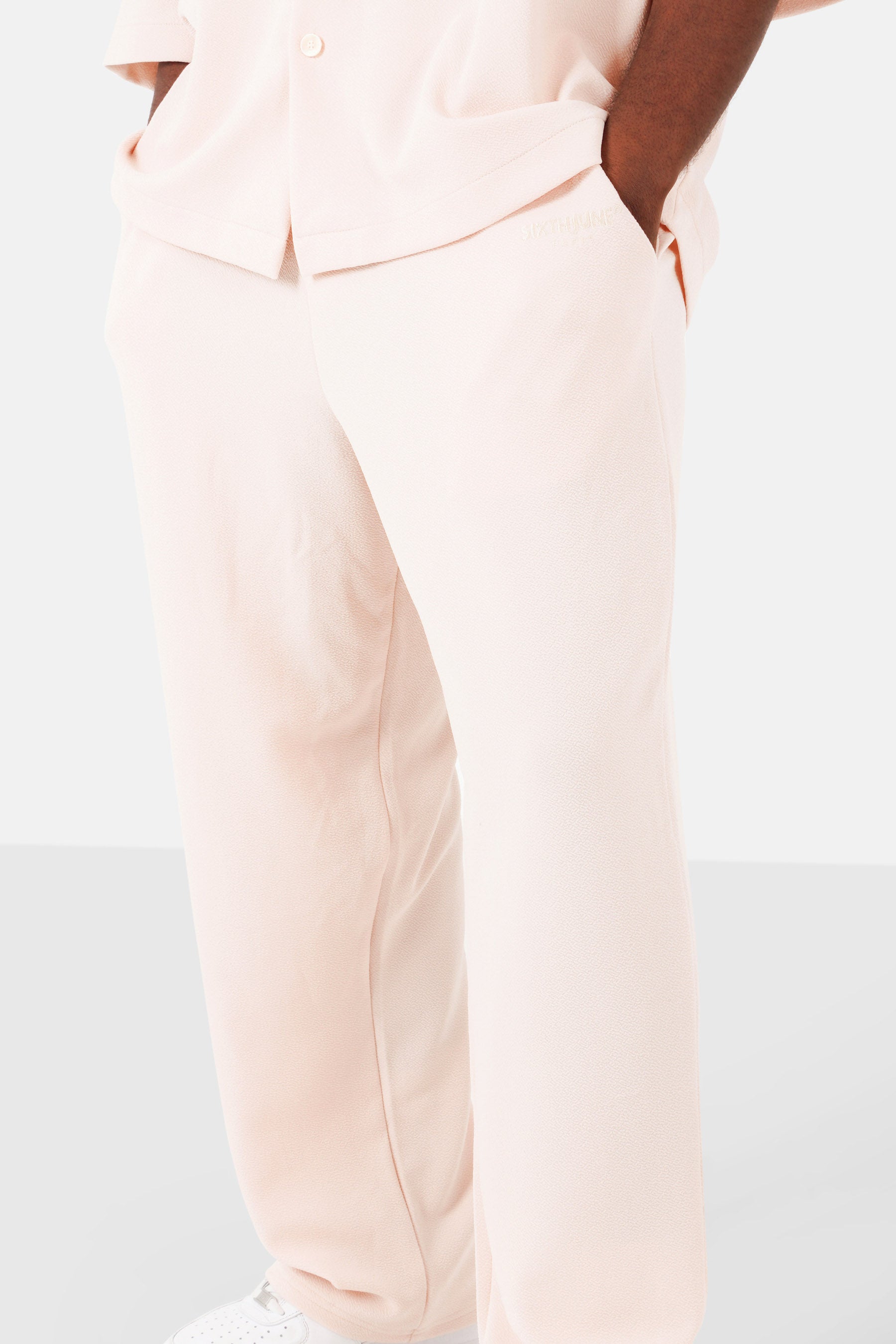 Textured logo pants Beige