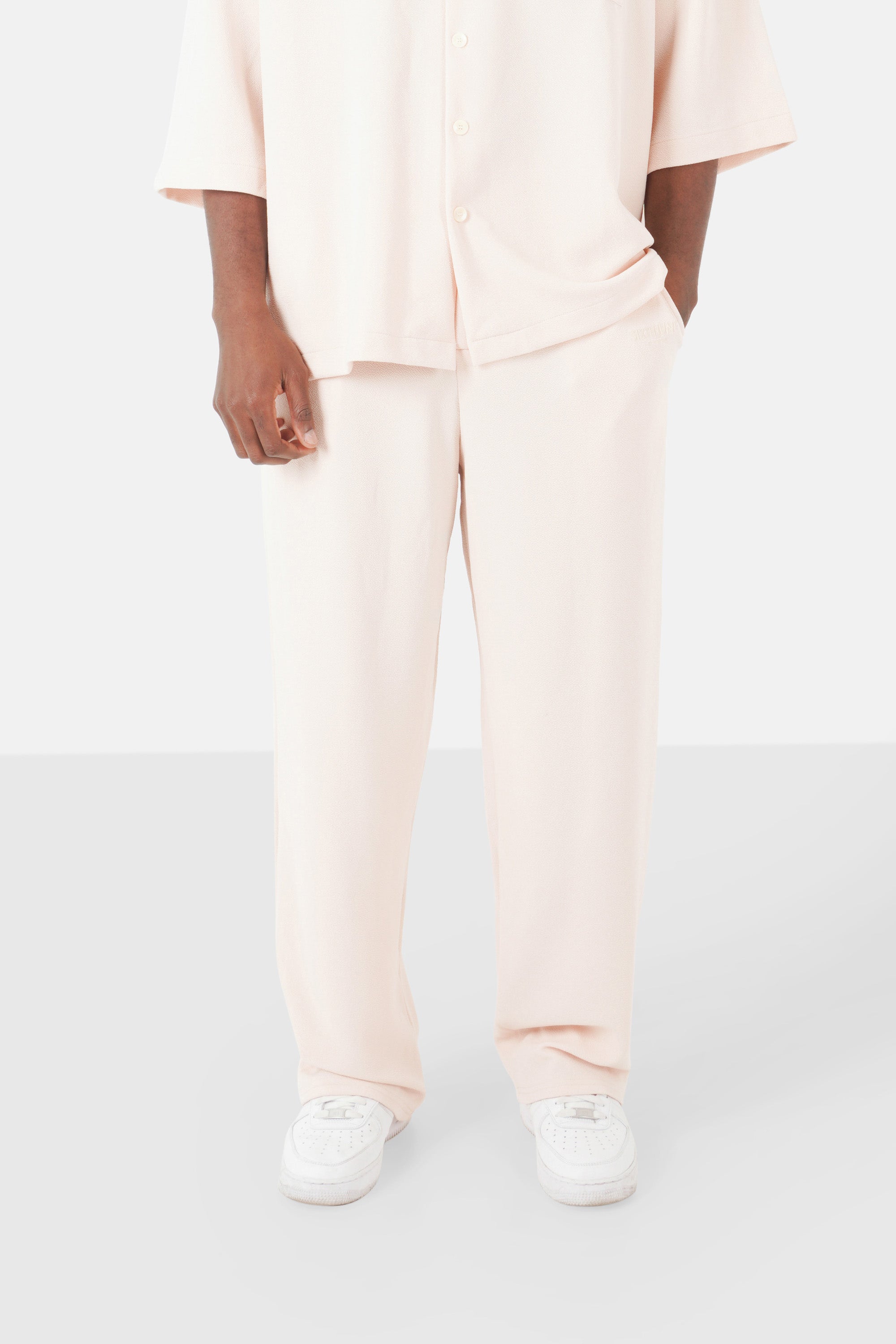 Textured logo pants Beige